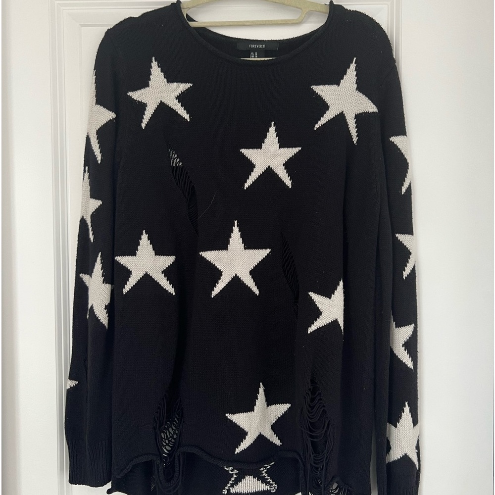 star printed ripped sweater